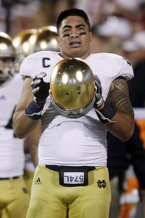 In this Oct. 27, 2012, file photo, Notre Dame linebacker Manti Te'o stands on the sidelines during an NCAA college football game against Oklahoma in Norman, Okla. The wrenching story of Te'o's girlfriend dying of leukemia _ a loss he said inspired him to play his best all the way to the BCS championship _ was dismissed by the school Wednesday, Jan. 16, as a hoax perpetrated against the linebacker. (AP Photo/Sue Ogrocki)