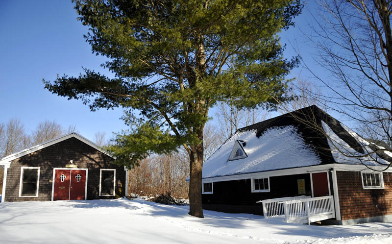 The St. Matthias Episcopal Church property and its two buildings, on a flat, half-acre lot, has been offered to the town of Richmond for free. Snow covers the lot on Monday.