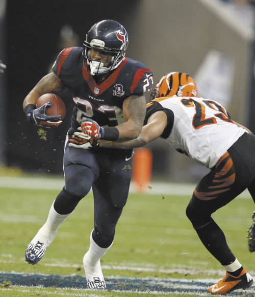 THREAT: Houston Texans running back Arian Foster, left, ran for 46 yards against the New England Patriots in a regular season game last month.