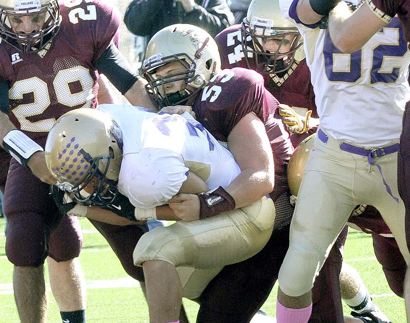 Thornton's Bobby Begin makes a tackle in an October game last season against Cheverus. Begin and Kurt Massey of John Bapst won the Frank Gaziano Scholarship and Award Sunday as the top high school football offensive and defensive linemen in the state.