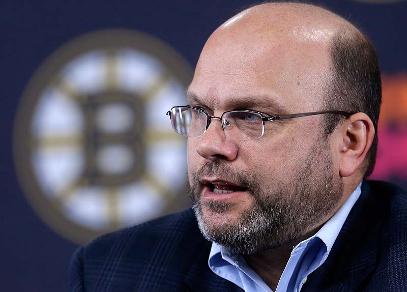 Boston Bruins GM Peter Chiarelli responds to a question from a reporter during a news conference at the TD Garden before Sunday's practice in Boston.