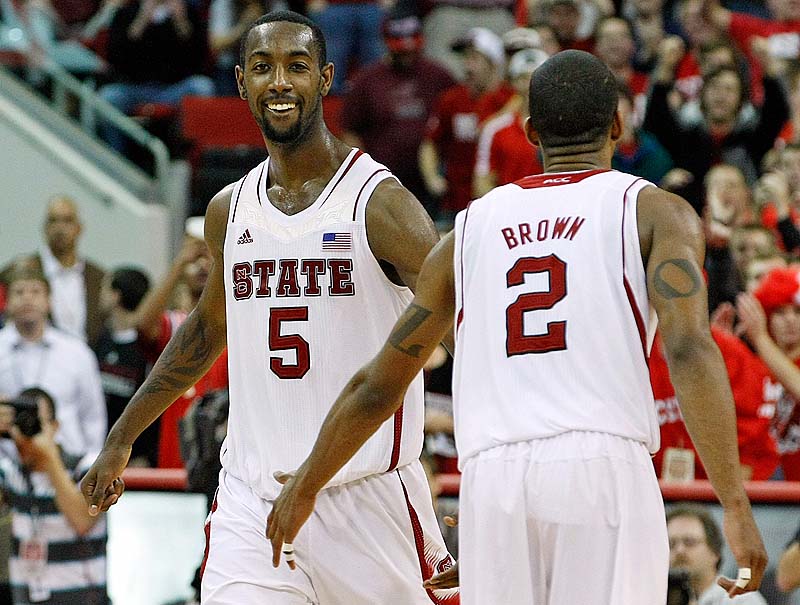 North Carolina State's C.J. Leslie, left, celebrates with Lorenzo Brown during the final minutes of Saturday's game against Duke. The Wolfpack upset the No.1 Blue Devils, 84-76.