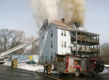 Firefighters respond to a blaze at 1 Penobscot St. in Augusta Tuesday afternoon.