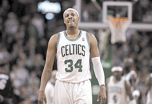 LEADING THE WAY: Boston forward Paul Pierce smiles as the Celtics take the lead in the second overtime against the Miami Heat on Sunday in Boston.