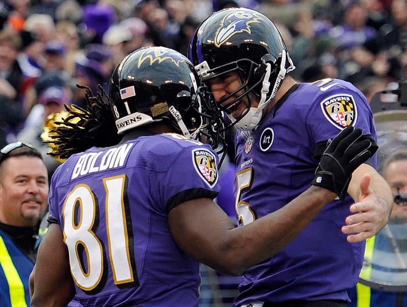 Anquan Boldin, left, of the Ravens celebrates his touchdown catch with quarterback Joe Flacco in Sunday's wild-card playoff game at Baltimore. The Ravens won, 24-9.
