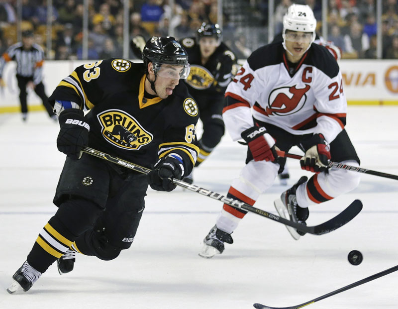 Boston Bruins forward Brad Marchand scored the decisive goal to give the Bruins a 2-1 win over the New Jersey Devils on Tuesday night.