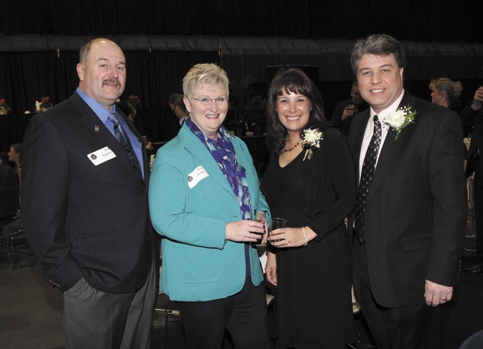 From left, Bob and Becky Nadeau with President's Award recipients Teresa and Randy Hutchins, of O'Connor Auto Group, at the Kennebec Valley Chamber of Commerce's annual awards banquet at the Augusta Civic Center on Friday night.