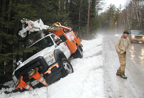 A Central Maine Power truck slid off David Pond Road in Fayette Thursday morning, just off the East Road.