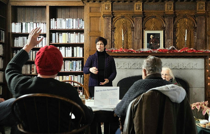 Todd Martin, left, asks a question of Rep. Gay Grant, D-Gardiner, during a fireside chat on Saturday in the Hazzard Reading Room at the Gardiner Public Library.