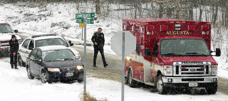Augusta Police and Fire departments responded to several accidents during the snow storm including this one near corner of Summerhaven Road and Civic Center Drive on Wednesday January 16, 2013.