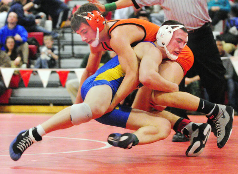 Skowhegan's Kameron Doucette, top left, and Belfast's Brent Waterman grapple in the 132-pound championship match during the KVAC wrestling championship on Saturday at Cony High School in Augusta. Waterman won 16-1.