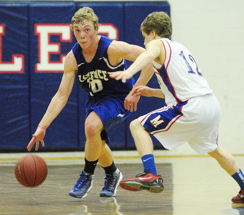 Lawrence's Matt Saunders, left, tries to dribble around Messalonskee's Quinn Warren during a game on Friday night at Messalonskee High School.