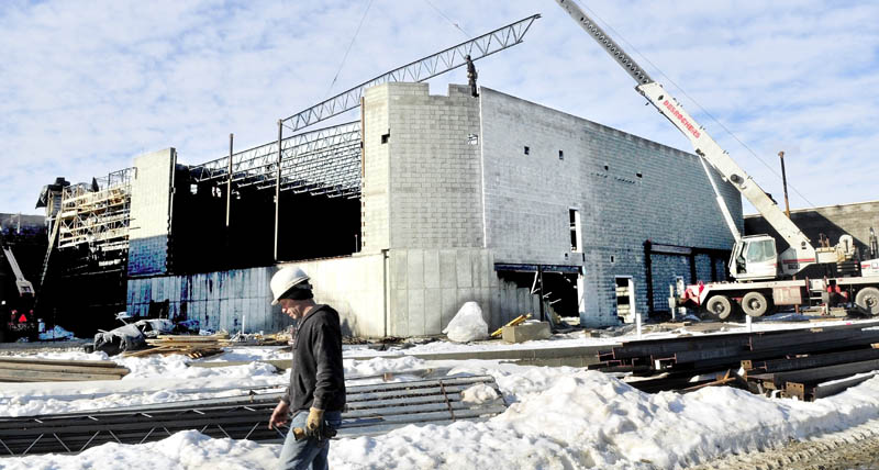 Construction workers with the Wright-Ryan Construction, erect the Bjorn Auditorium at Mt. Blue High School Learning Campus in Farmington recently.