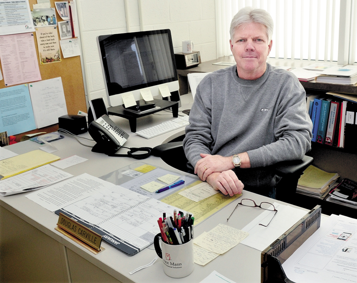 Winslow High School Principal Doug Carville in his office on Monday. Carville will leave his position at the end of the school year to pursue other employment.