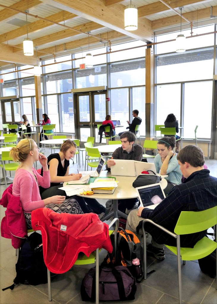 Students do schoolwork in the bright and spacious Food Court area in the new expansion project at Mt. Blue High School Learning Campus in Farmington recently.