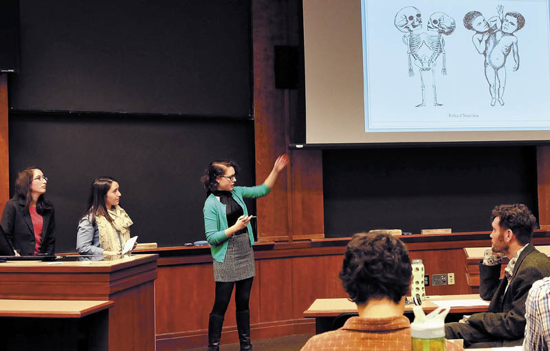 Colby College anatomy class students from left, Erin Bewley, Kali Stevens and Erin Hoover discuss their study on conjoined twins during presentations held at Colby College on Wednesday. Listening at right is professor Thomas Klepach.