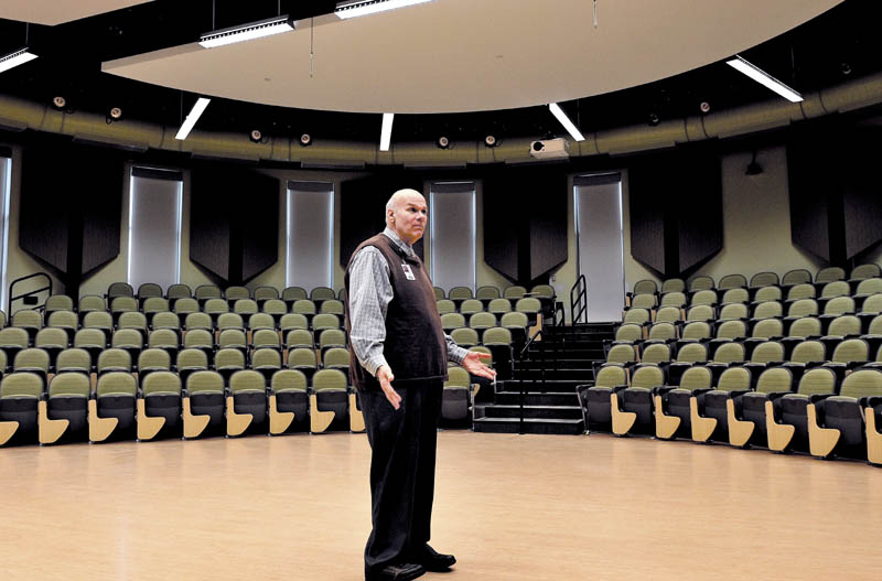 Regional School Unit 9 Superintendent Michael Cormier shows off the Forum room in the Mt. Blue High School Learning Campus expansion project in Farmington recently.