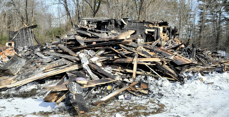 Remains of part of a huge barn that burned on Saturday at the home of Maine filmmaker Richard Searls, on the River Road in Solon. Lost in the fire were tractors, farm equipment, tools and a lifetime of master film reels and original videotape.