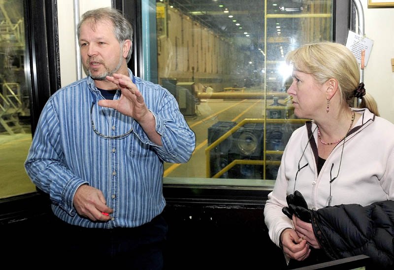 Sappi Fine Paper Plant Manager Tony Ouellette and Marketing Director Heather Pelletier discuss the Skowhegan mill from a control room inside the mill Thursday.