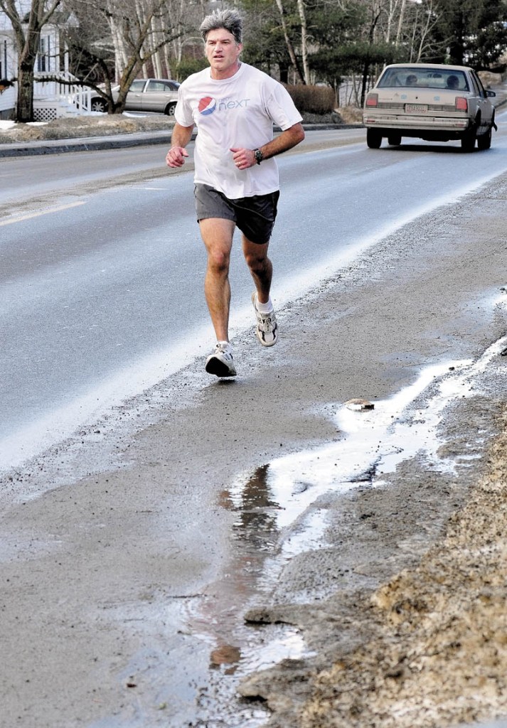 Steve Tosi took advantage of an unseasonably warm Monday, while running in Waterville.
