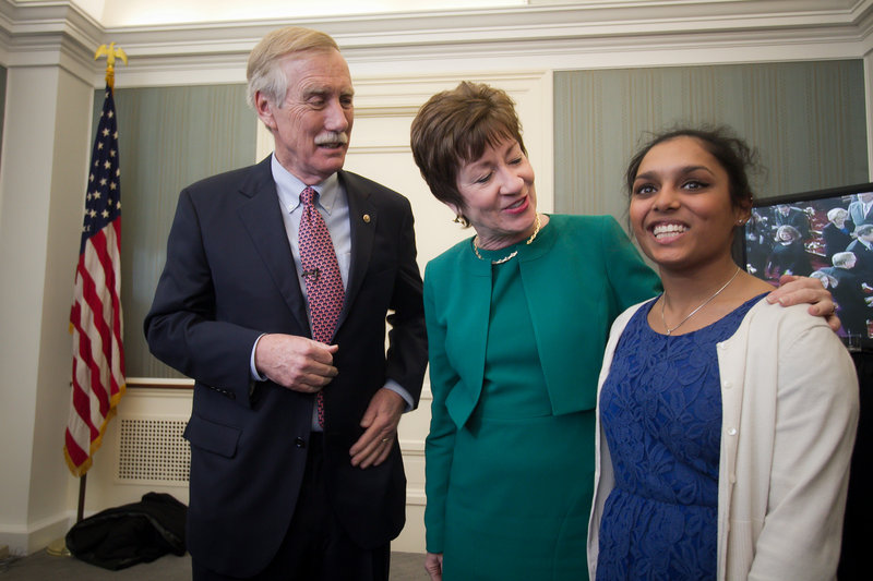 Maine Sen. Susan Collins pays a visit to Sen. Angus King and his daughter, Molly, during a reception after King’s swearing-in Thursday.