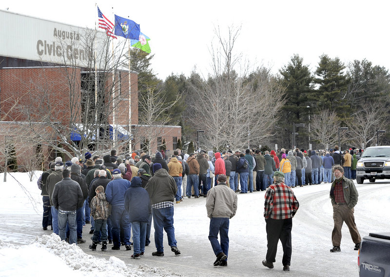 Gun enthusiasts line up for the 9 a.m. opening of a gun show at the Augusta Civic Center on Saturday, the first in Maine since the Newtown, Conn., shooting deaths Dec. 14 generated debate on tighter controls.