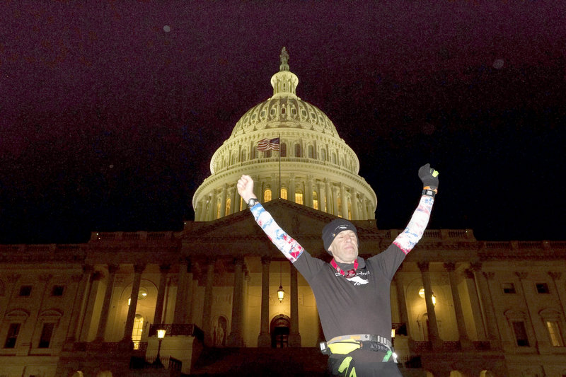 Exhausted from his run, Gary Allen, 56, from Great Cranberry Island, celebrates after finally reaching the U.S. Capitol on Monday. Allen averaged 50 miles a day as he ran 700 miles from Maine to Washington, DC, in two weeks for charity.