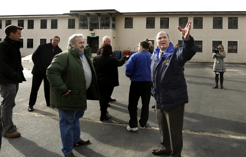 Maine Correctional Center Superintendent Scott Burnheimer, right, leads a tour of the facility Friday for a group of state lawmakers who wanted to see it firsthand. At left is Stan Gerzofsky, D-Brunswick, the Senate chair of the Legislature’s Criminal Justice and Public Safety Committee.