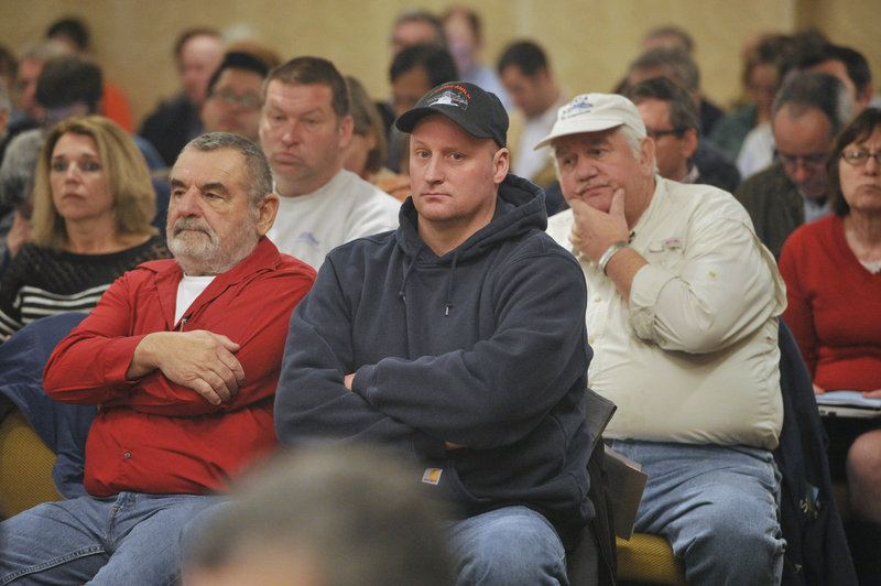 Fishermen listen to scientists and regulators during the New England Fishery Management Council meeting in Portsmouth, N.H. Many fishermen oppose lower catch limits, but advocates argue they are critical to preserving the future of fish stocks.