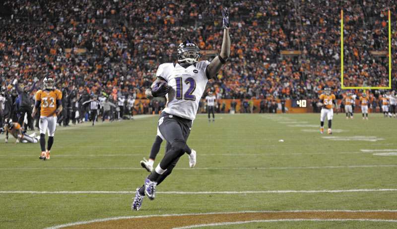 GAME CHANGER: Baltimore Ravens wide receiver Jacoby Jones celebrates as he crosses the goal line for a touchdown late in the fourth quarter against the Denver Broncos in an AFC divisional playoff game, Saturday in Denver. Sports Authority Field at Mile