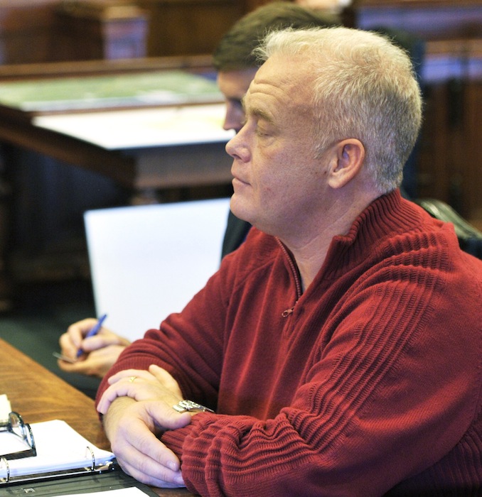 Barry Spencer listens as the judge gives the jury instructions prior to opening arguments on Monday, Feb. 4, 2013.
