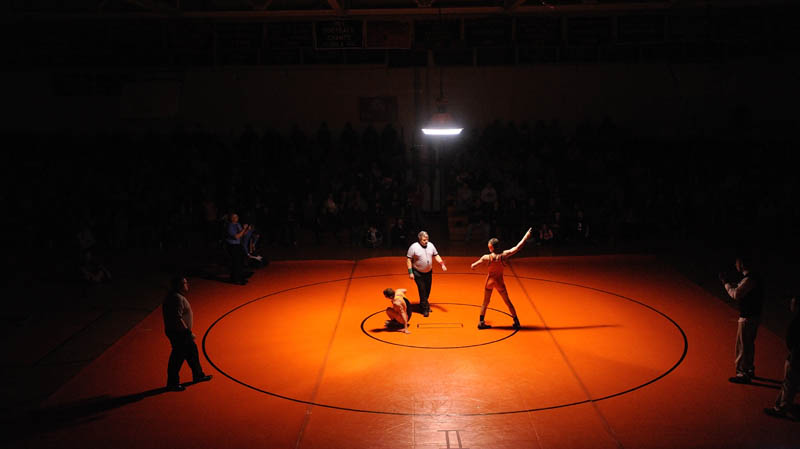 CENTER OF ATTENTION: Skowhegan Area High School’s Kameron Doucette, right, celebrates his win over Mt. Blue High School’s Kevin Moore, in the 132-pound Eastern A championship bout Saturday at Skowhegan Area High School.