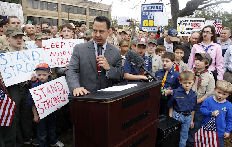Surrounded by area scouts, Jonathan Saenz, president of Texas Values, reads the press release to that crowd announcing that the Boy Scouts of America will be postponing its decision to admit gays at the “Save Our Scouts” Prayer Vigil and Rally in front of the Boy Scouts of America National Headquarters in Irving, Texas, Wednesday, February 6, 2013. (AP Photo/Richard Rodriguez)