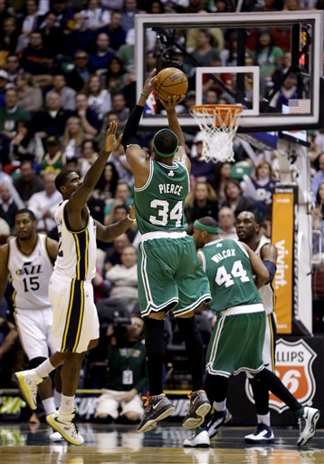 Boston Celtics' Paul Pierce (34) shoots as Utah Jazz's Marvin Williams (2) defends in the second half during an NBA basketball game Monday, Feb. 25, 2013, in Salt Lake City. The Celtics defeated the Jazz 110-107. (AP Photo/Rick Bowmer)