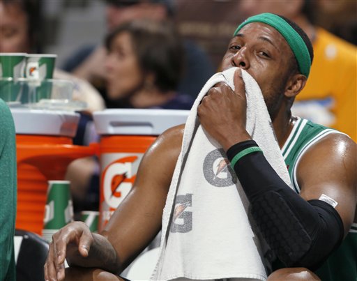 Boston Celtics forward Paul Pierce takes a seat on the bench during the first quarter of an NBA basketball game against the Denver Nuggets in Denver on Tuesday, Feb. 19, 2013. (AP Photo/David Zalubowski)
