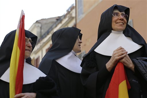 Nuns gather near the Pope's summer residence of Castel Gandolfo, the scenic town where Pope Benedict XVI will spend his first post-Vatican days.
