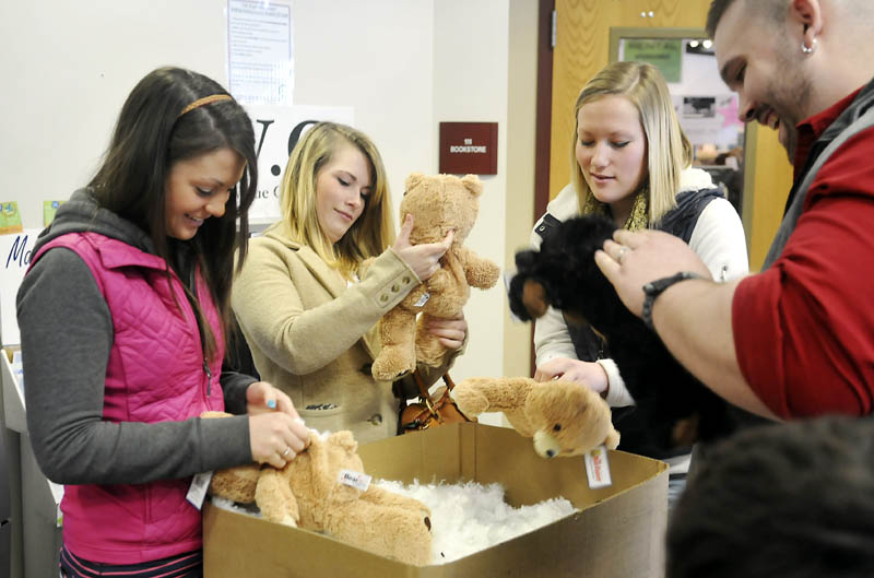 University of Maine at Augusta students stuff teddy bears Thursday at the student center as part of a Valentine's Day celebration. The White House has launched the College Scorecard, an online tool to review the expenses and graduation rates of colleges across the nation, including UMA.