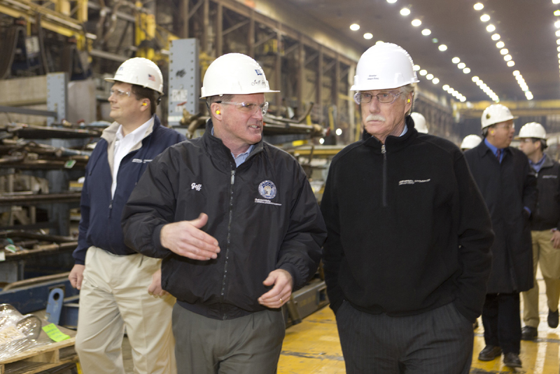 Bath Iron Works president Jeff Geiger talks with Sen. Angus King Thursday, as King and Sen. Susan Collins toured the shipbuilding plant.