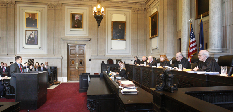 Assistant District Attorney Patrick Gordon takes questions from justices of the Maine Supreme Judicial Court in Portland on Wednesday. The court heard oral arguments in the appeal by prosecutors the dismissal of invasion of privacy charges against Mark Strong, Sr.