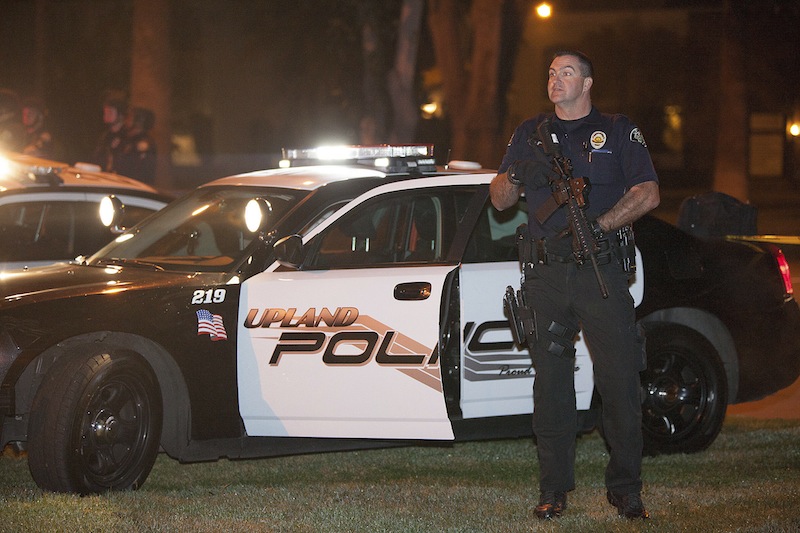 Police respond in Riverside, Calif., early Thursday morning, after one officer was killed and another critically wounded in a shoot out with a murder suspect.