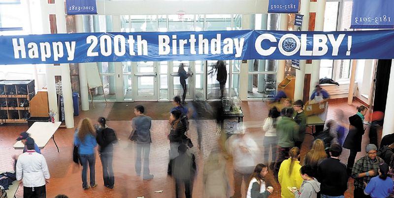Students and faculty walk under a banner to celebrate Colby College's 200th birthday at Cotter Union on Wednesday. The celebration featured a multi-media presentation highlighting the past 200 years and a presentation delivered by Colby College President, William "Bro" Adams at the Strider Theatre.