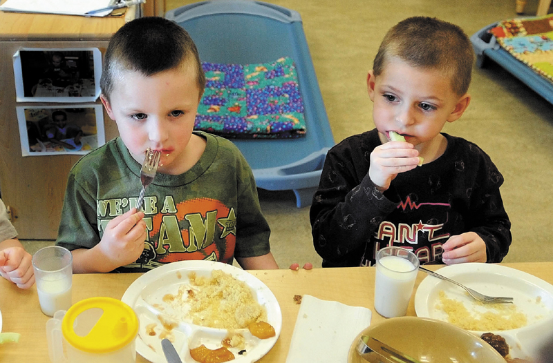Justis Greene, 4, and Kayder Johnson, 5, eat lunch at Educare Central Maine in Waterville Thursday.