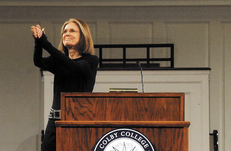Gloria Steinem, a journalist and activist, applauds a capacity crowd at Lorimer Chapel at Colby College during her introduction as guest speaker for SHOUT Thursday.