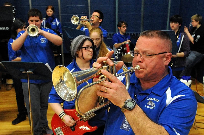 The Lawrence High School pep band performs during warmups before the Lawrence-Skowhegan boys' basketball game in Fairfield Tuesday night.