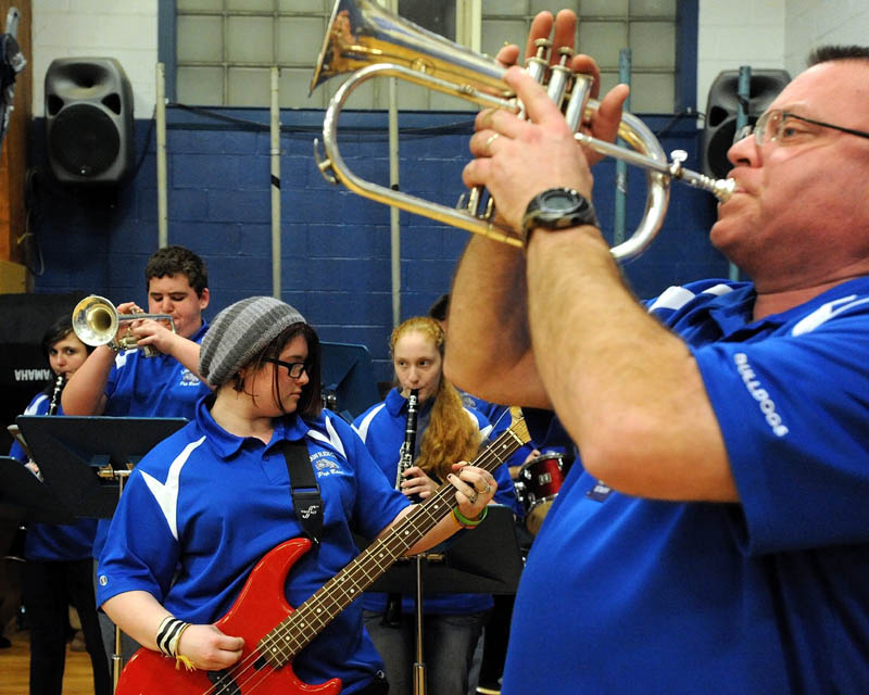 The Lawrence High School pep band performs during warmups before the Lawrence-Skowhegan boys' basketball game in Fairfield Tuesday night.