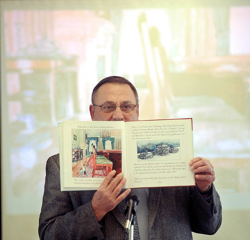 Gov. Paul LePage reads "Baxter at the Blaine House" to the student body as part of the 2013 Catholic Schools Week celebration at St. John Regional Catholic School on South Garand Street in Winslow on Friday morning.