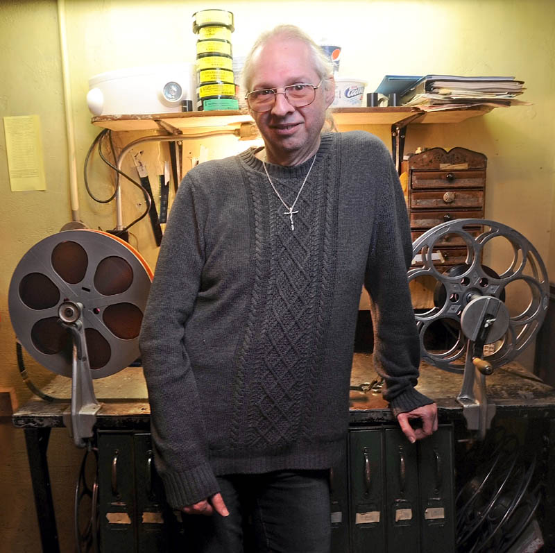 Bill Lashon, the sole projectionist at the Pittsfield Community Theatre on Main Street, stands in the projection booth Thursday. Lashon's job may be in the balance with the movie industry shifting from 35 mm film to digital by the end of the year.