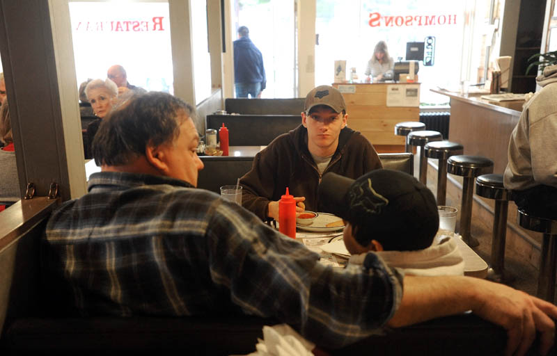 Parker Stevens, left, sits with his two sons, Seth, 19, center, and Brady, 12, during lunch at Thompson's restaurant on Main Street in Bingham on Wednesday. Parker was the owner of the restaurant, before selling to Jay Strickland recently.