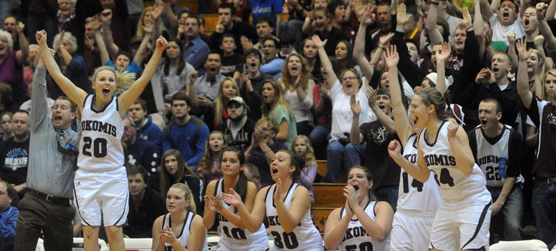 Nokomis players and coaches cheer a 3-pointer that tied the game late in the fourth quarter Wednesday in an Eastern Class B quarterfinal against Camden Hills at the Bangor Auditorium. Nokomis won, 45-40.