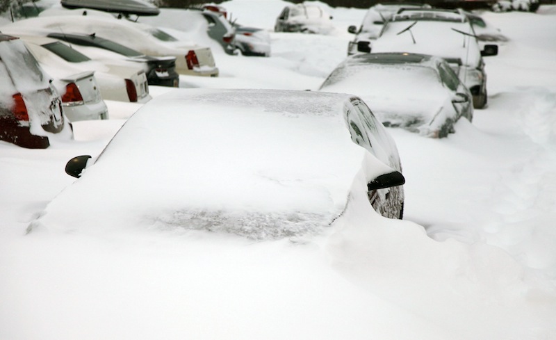 Cars sit buried by snowdrifts in a parking lot in Southington, Conn., Saturday, Feb. 9, 2013, after a heavy snowfall and high winds from a storm dumped more than 2 feet of snow on New England. (AP Photo/Robert Ray)